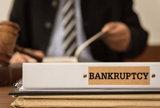 Bankruptcy document folder with lawyer work at law firm.