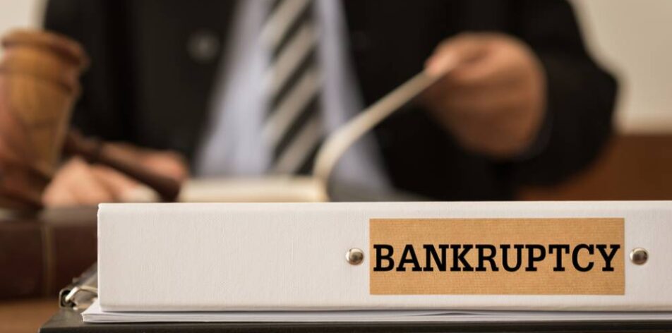 Bankruptcy document folder with lawyer work at law firm.